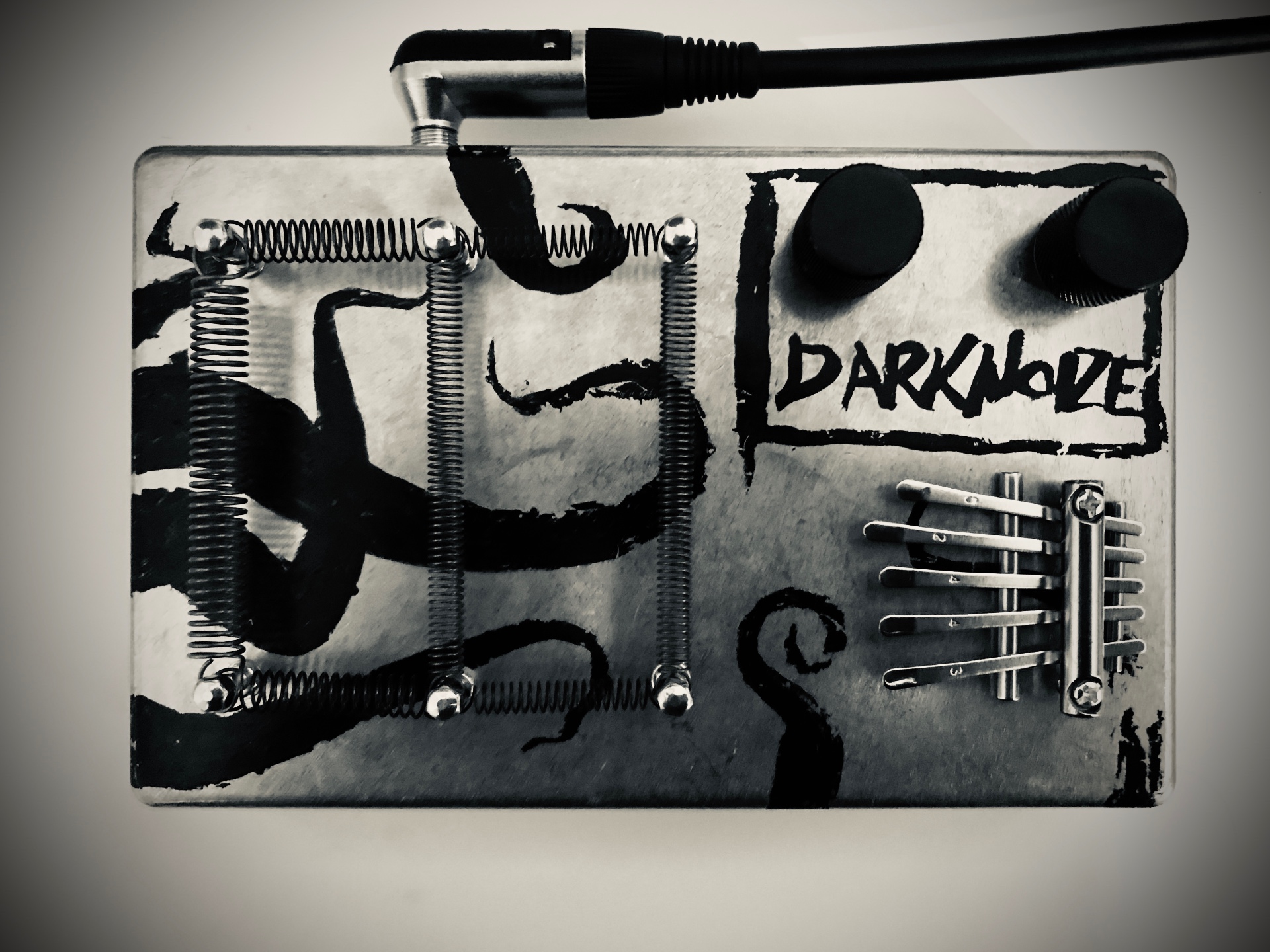 Self-built DarkNoize noise box with springs, knobs and kalimba tines